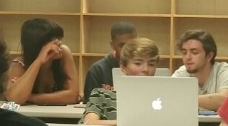 Three students working on a website together