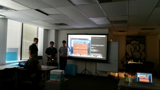 Students sharing their project on the projector